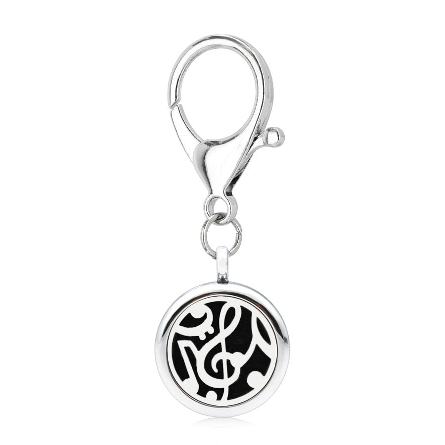 Aleación al por mayor de 25 mm hueco nuevo alas de flores aromaterapia llavero esencial de aceite