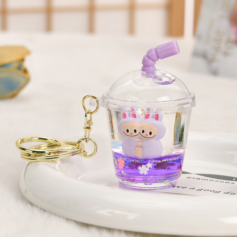 Wholesale Oil-filled acrylic doll cylindrical cup with flowing sand bottle keychain