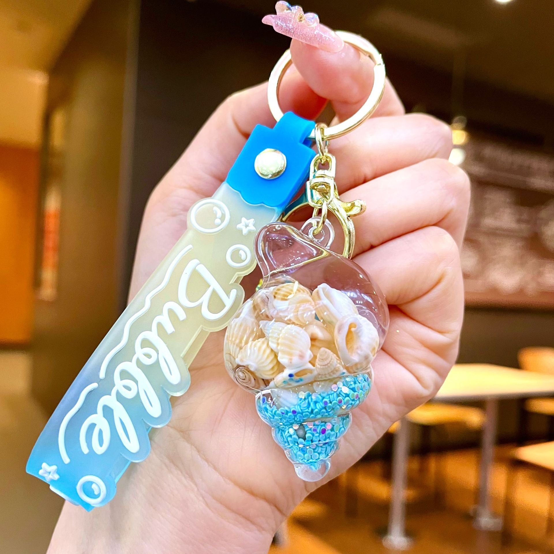 Wholesale Colorful flowing sand seashell DIY insert oil keychain