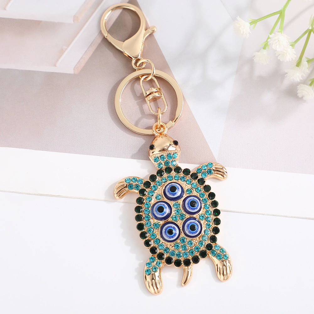 Wholesale Turtle shell with devil' s eye inlaid with rhinestones Metal Keychain