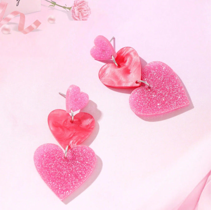 Wholesale  Heart-shaped Stud Earrings With a Triple Dangle Design.