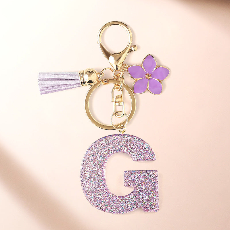 Wholesale Sparkling Pink 26 English Letter Purple Flower Keychain