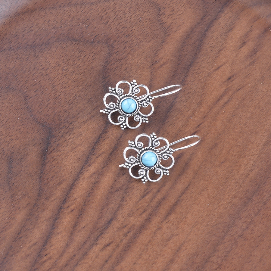 Wholesale Hollow petal inlaid turquoise drop earrings