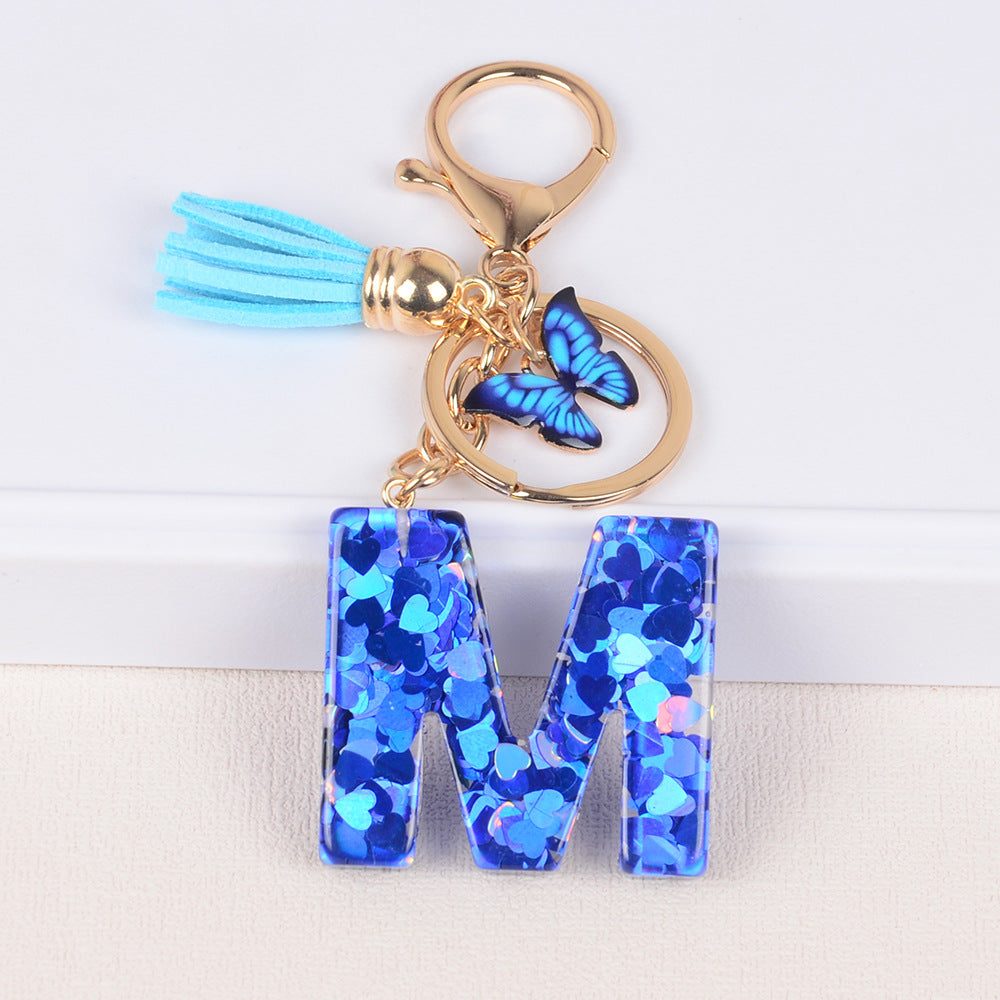 卸売ブルーラブバタフライタッセルレター樹脂キーホルダー