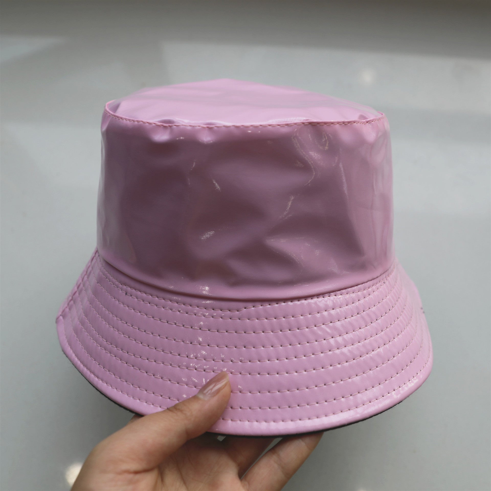 Wholesale of Solid Color Patent Leather with Polyester Fisherman Hats on Both Sides