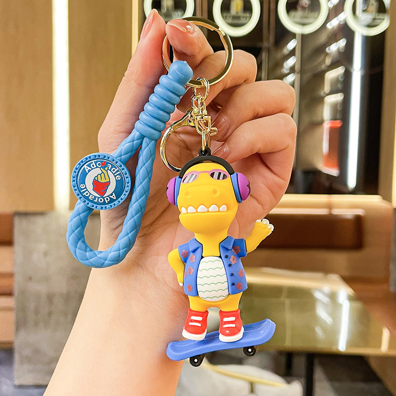 Wholesale New Creative Music Skateboard Dinosaur Doll Pvc Keychain