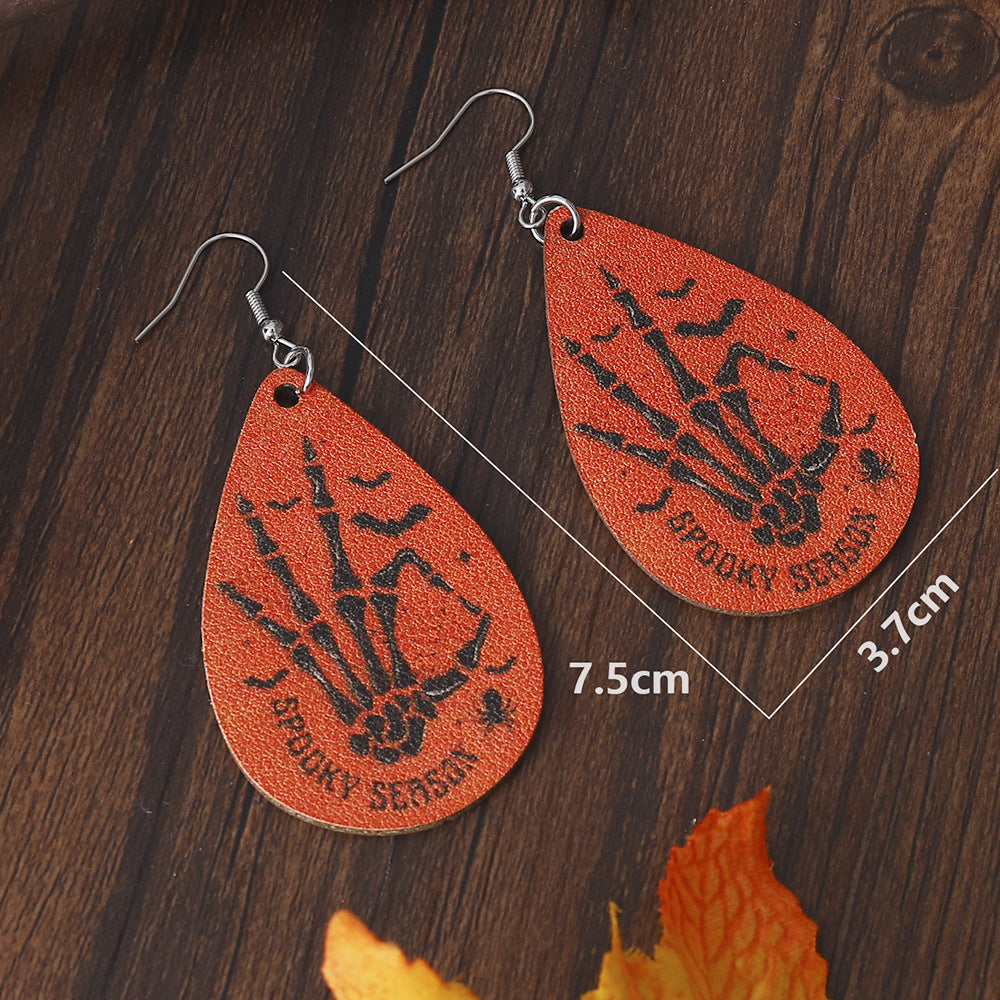 Pendientes de cuero PU de doble cara al por mayor de calavera.