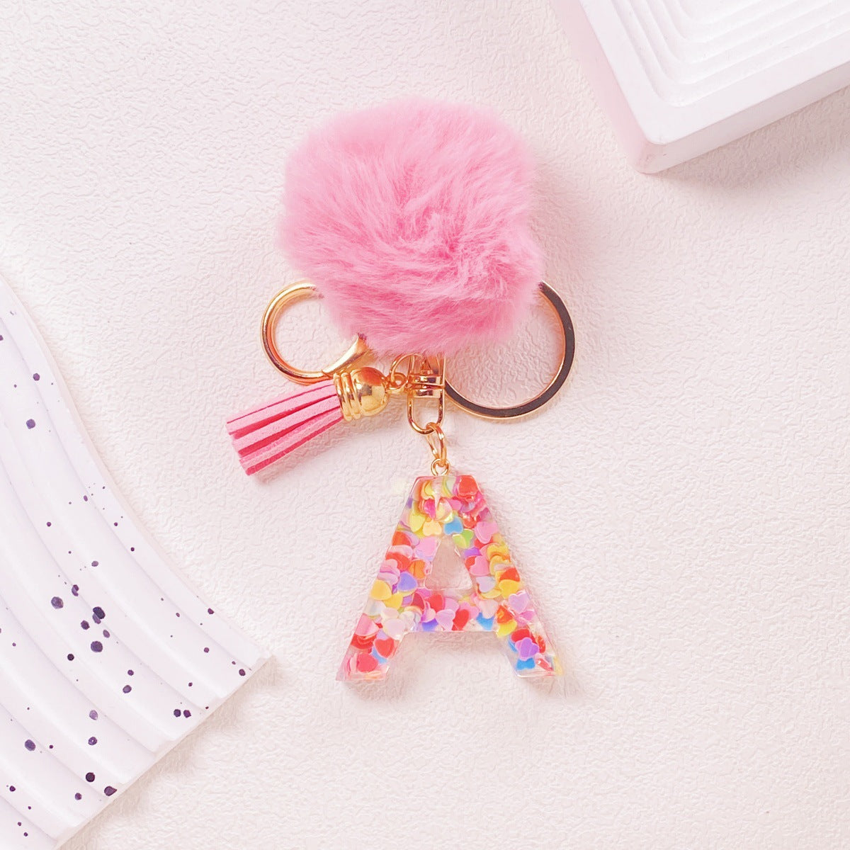Wholesale Hairball English 26 letter pink Pom Pom keychain