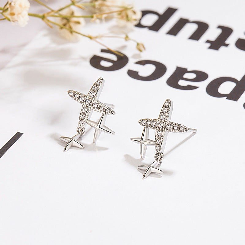 Pendientes al por mayor de cobre de diamantes estrella de cuatro puntajes