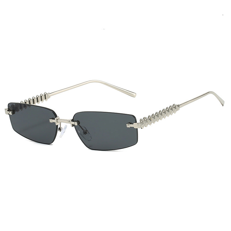 Wholesale New fashion frameless triangle cat-eye cut edge trendy street shooting retro versatile sunglasses