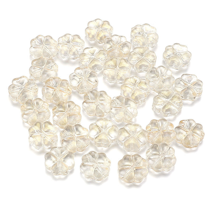 Al por mayor de 50 piezas/paquete de vidrio de color transparente de color trébol de cuatro hojas