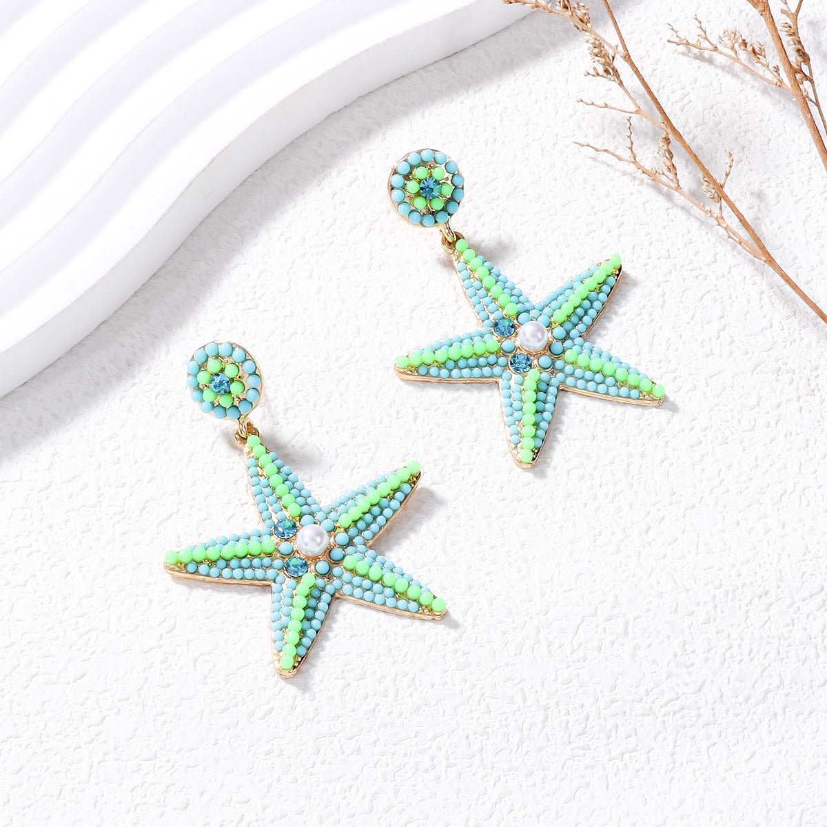 Wholesale of Butterfly Five Pointed Star Pearl Alloy Earrings