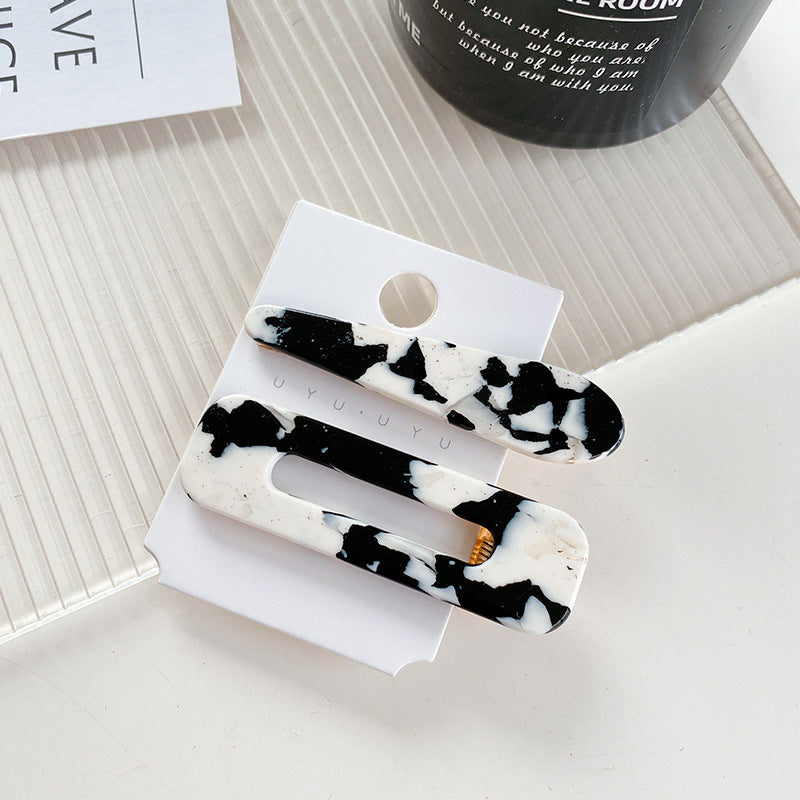 Wholesale Cow Black and White Medium Hollow Acetate Plate Hair Clips