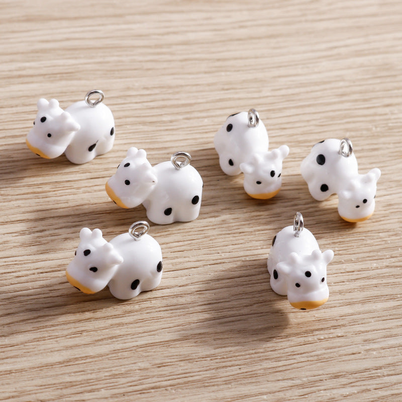 Wholesale 10 PCS/PACK of Cartoon Cow Resin Accessories DIY Keychain Jewelry Pendant