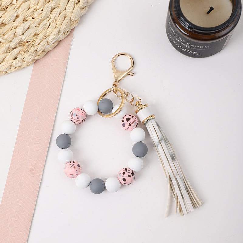 Llavero de muñeca de silicona de borla al por mayor