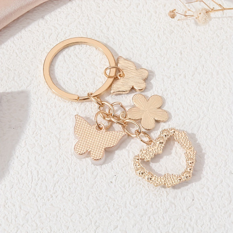 Wholesale Butterfly flower alloy keychain heart diamond small white flower pendant
