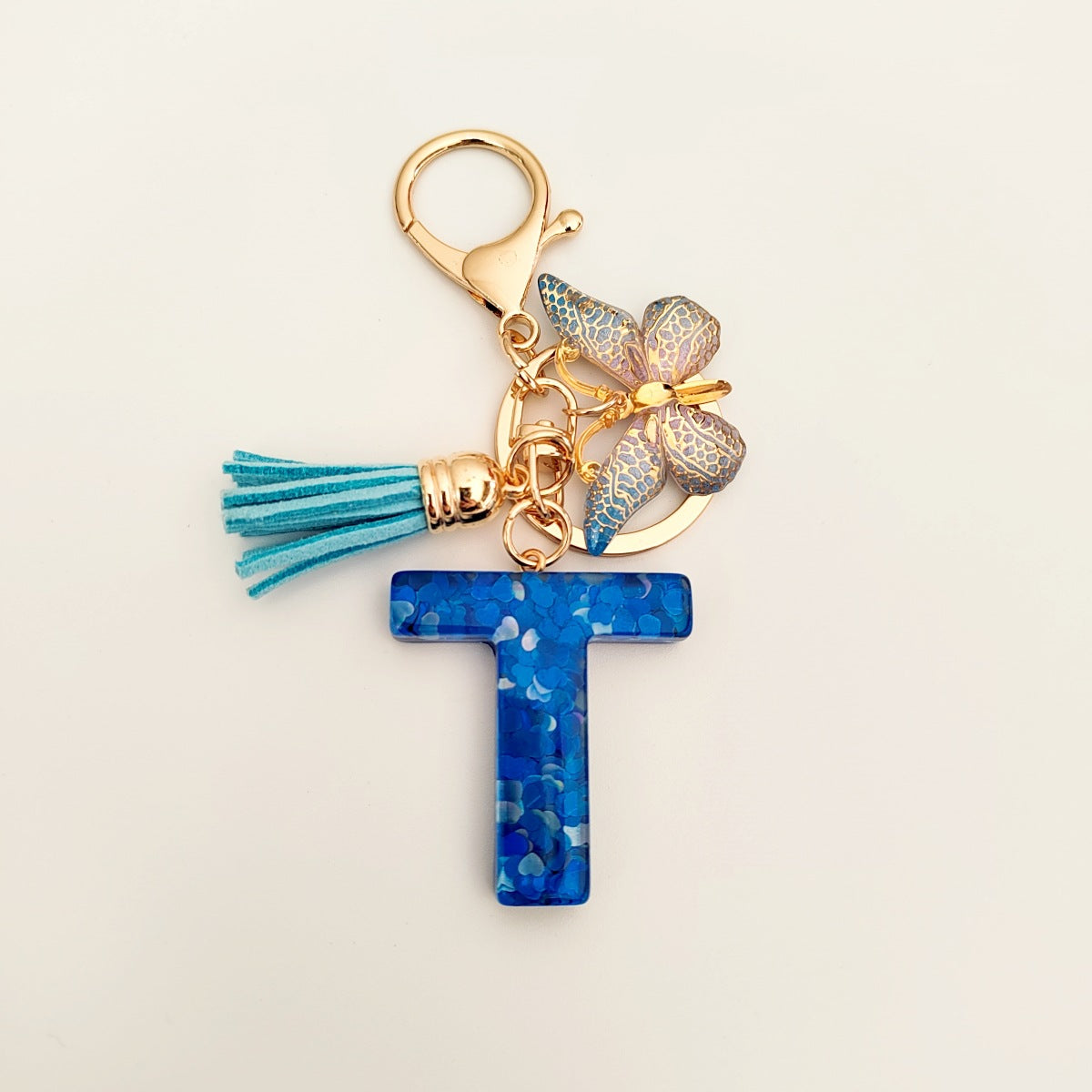 Wholesale blue crystal epoxy letter key chain pendant resin sequined butterfly key chain