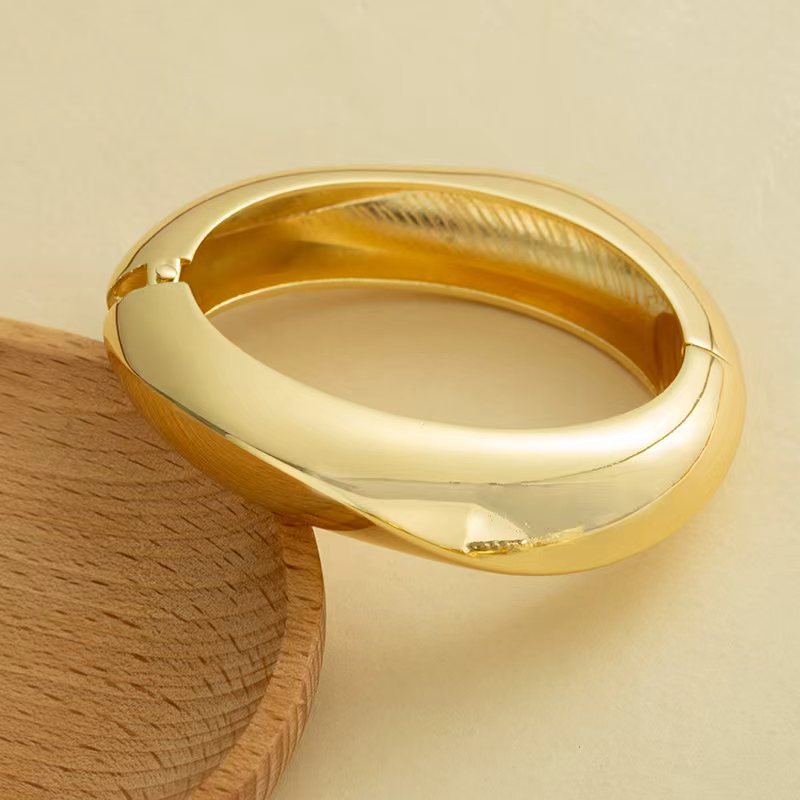 Wholesale Golden wide edged wave band exaggerated bracelet