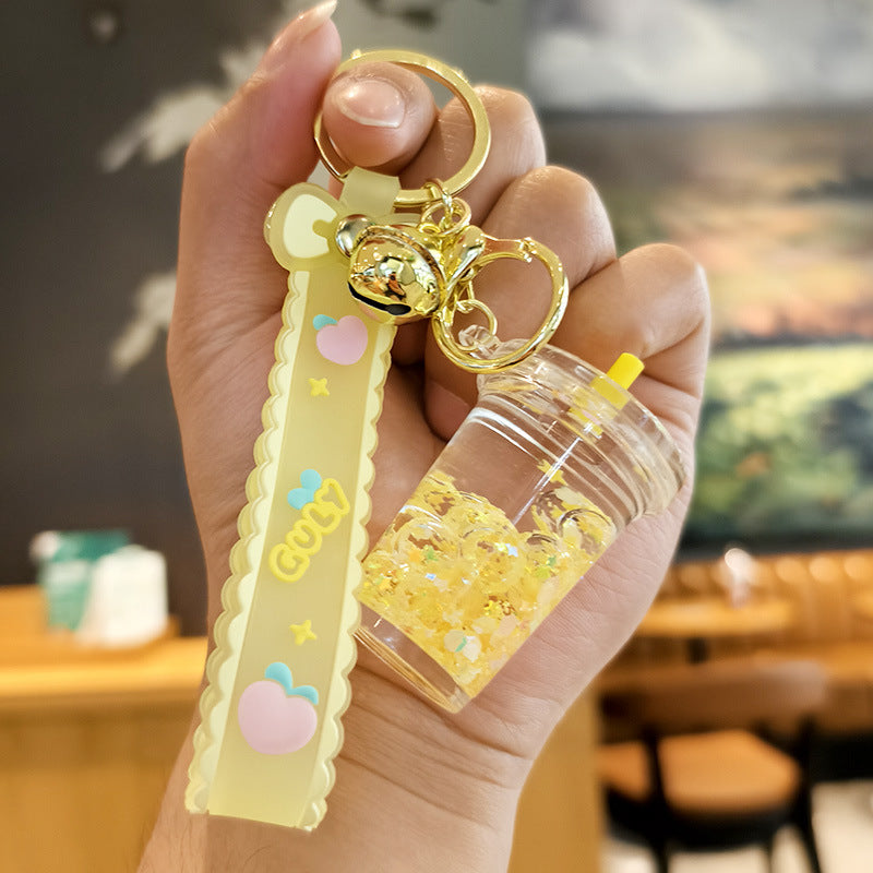 Wholesale quicksand luminous cup keychain liquid oil drift bottle pendant