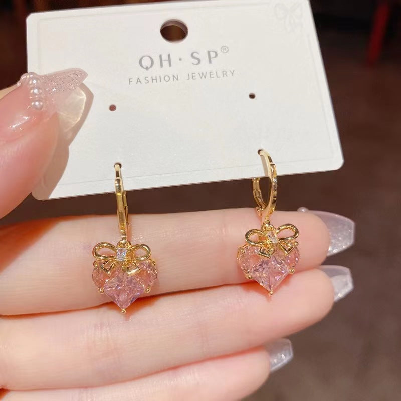 Wholesale Romantic heart-shaped peach pink earrings, fresh and sweet, simple and cool, super shiny earrings