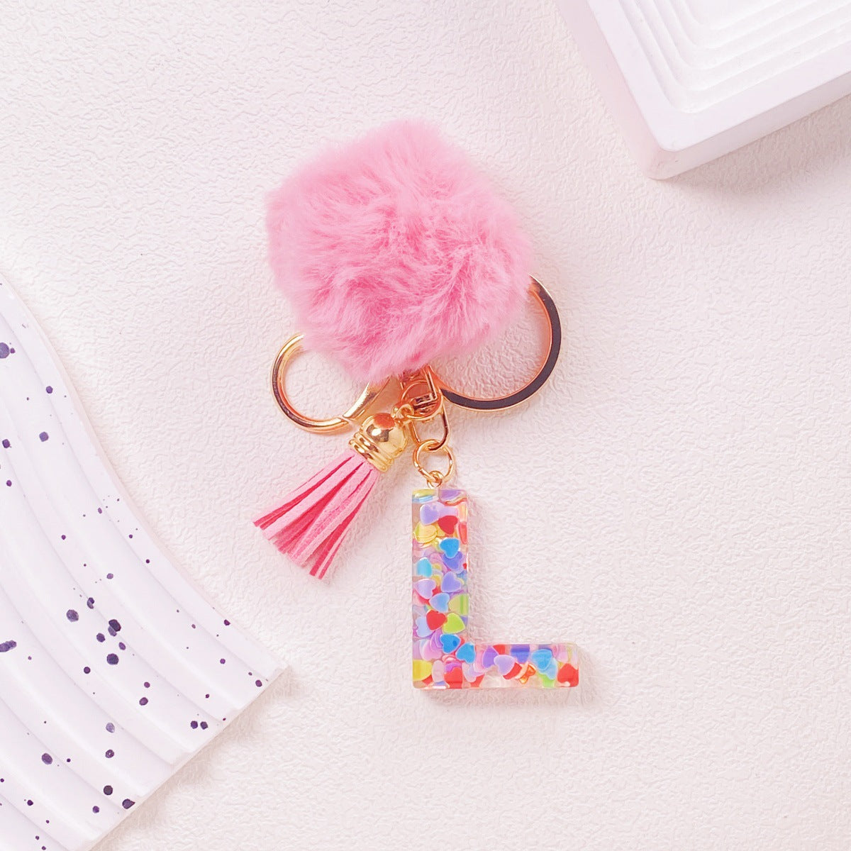 Wholesale Hairball English 26 letter pink Pom Pom keychain