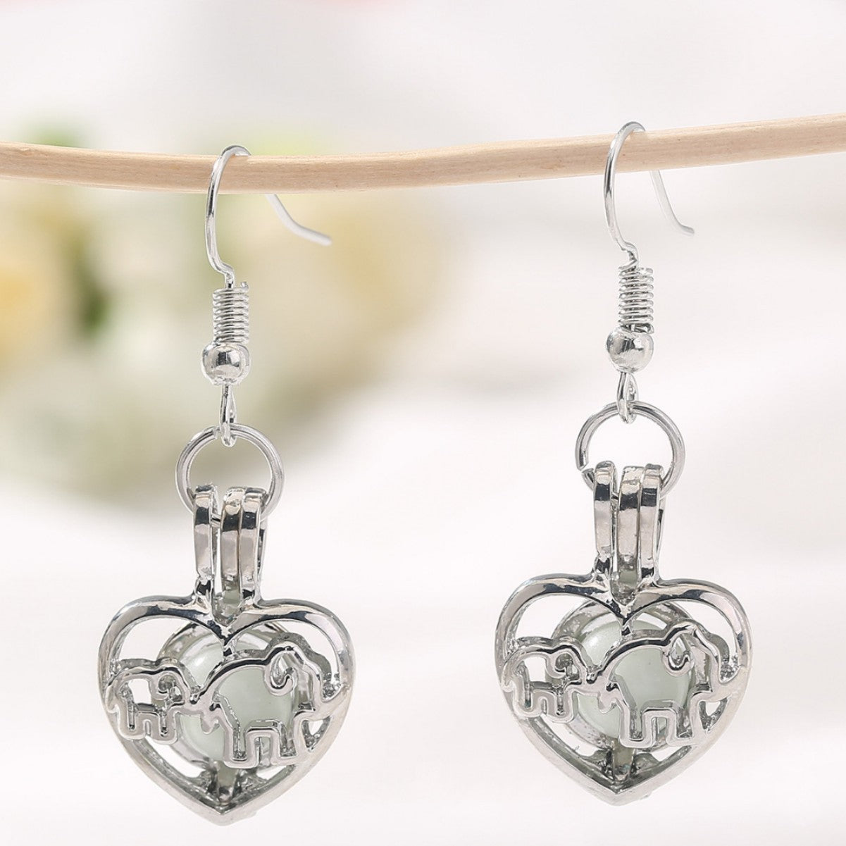 Wholesale Animal elephant baby elephant love hollow luminous earrings