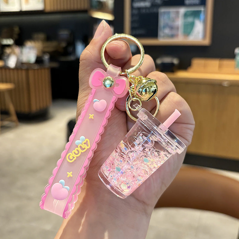 Wholesale quicksand luminous cup keychain liquid oil drift bottle pendant