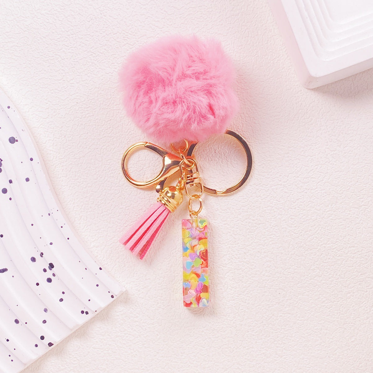 Wholesale Hairball English 26 letter pink Pom Pom keychain