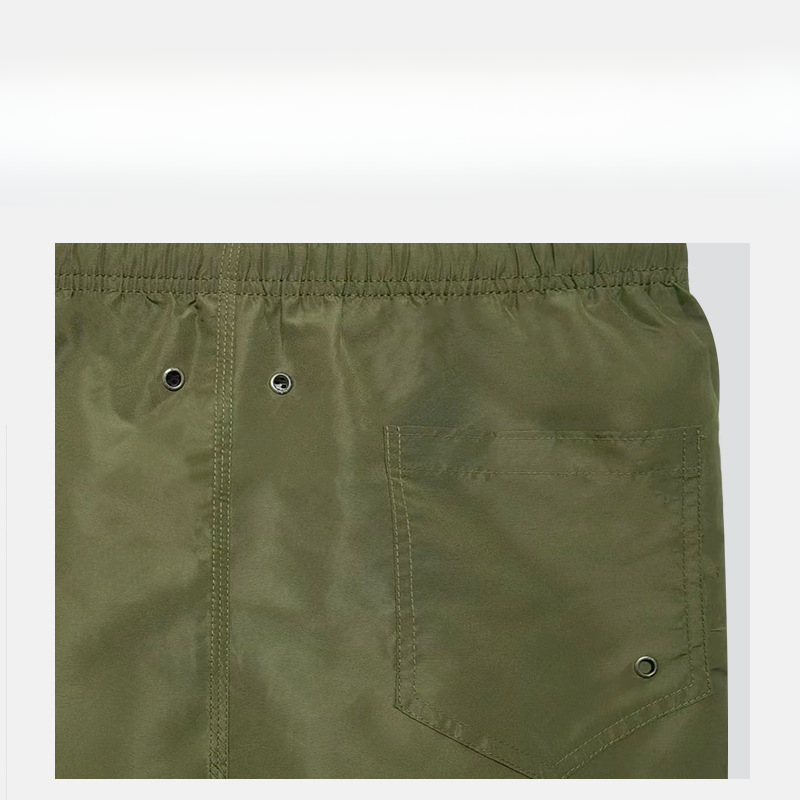 Pantalones cortos de tablero al por mayor los pantalones cortos de tiro sueltos de costura de hombres