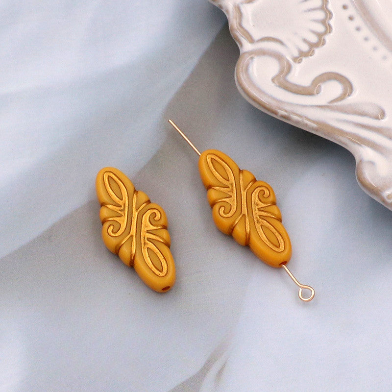 Wholesale of 10PCS Vintage Gold Relief Patterned Plastic Beads