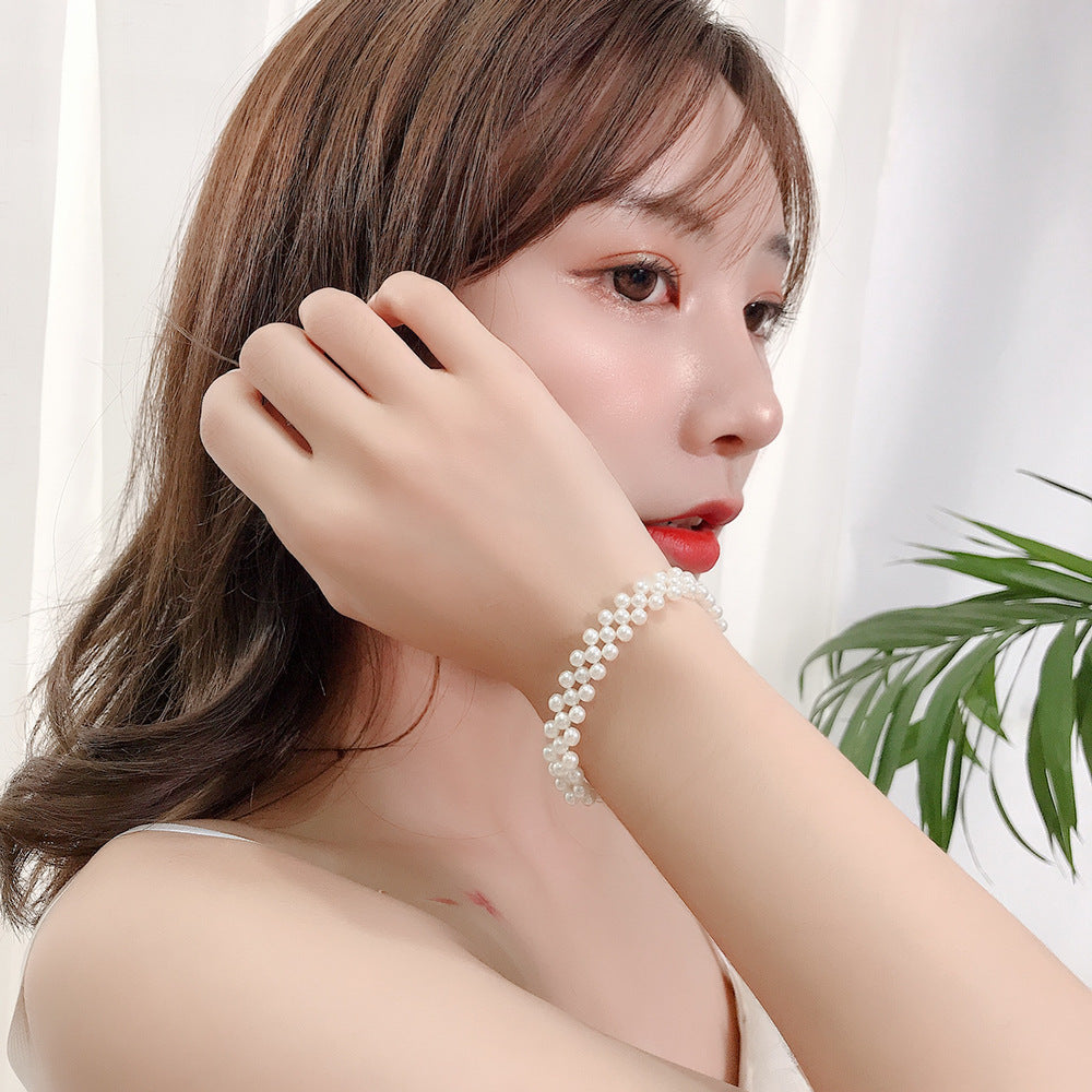 Wholesale Openwork Braided Pearl Alloy Bracelet
