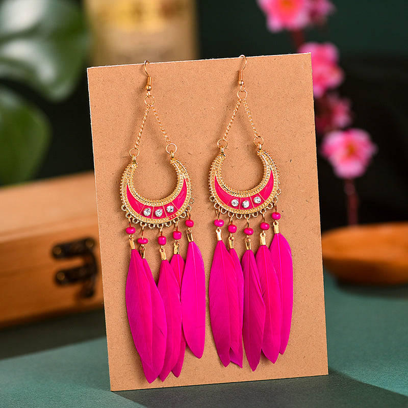 Venta al por mayor Pendientes De Aleación De Plumas Largas Media Redonda