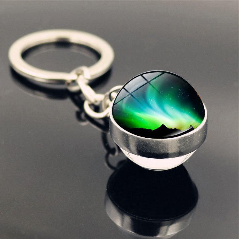 Aleación de zinc al por mayor aurora llavero de pelota de vidrio de doble cara