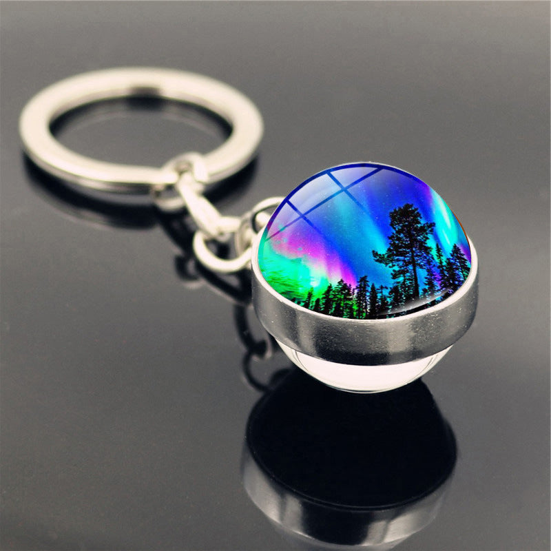 Aleación de zinc al por mayor aurora llavero de pelota de vidrio de doble cara