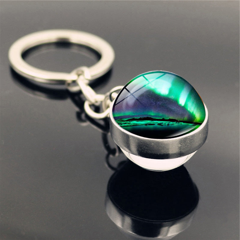 Aleación de zinc al por mayor aurora llavero de pelota de vidrio de doble cara