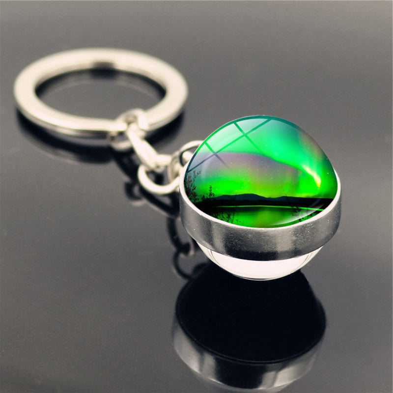 Aleación de zinc al por mayor aurora llavero de pelota de vidrio de doble cara