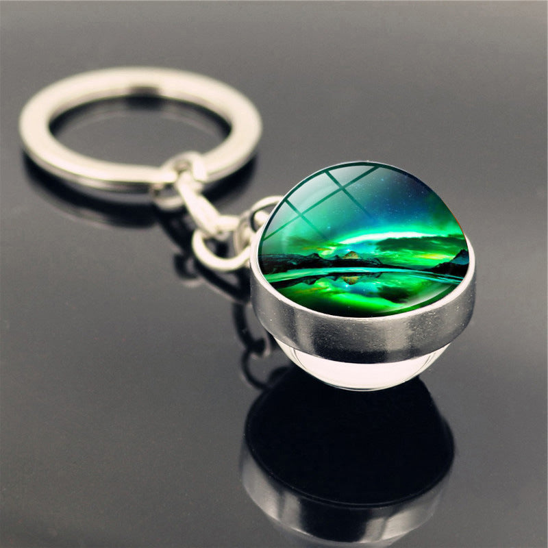 Aleación de zinc al por mayor aurora llavero de pelota de vidrio de doble cara