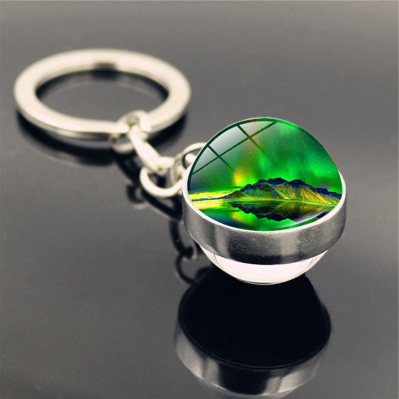 Aleación de zinc al por mayor aurora llavero de pelota de vidrio de doble cara