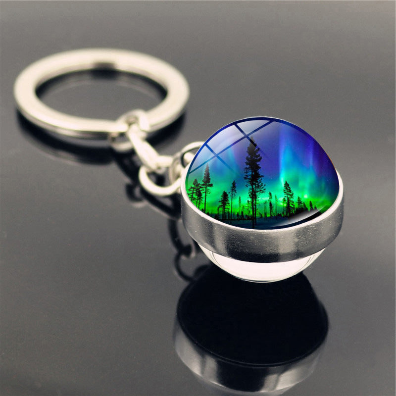 Aleación de zinc al por mayor aurora llavero de pelota de vidrio de doble cara