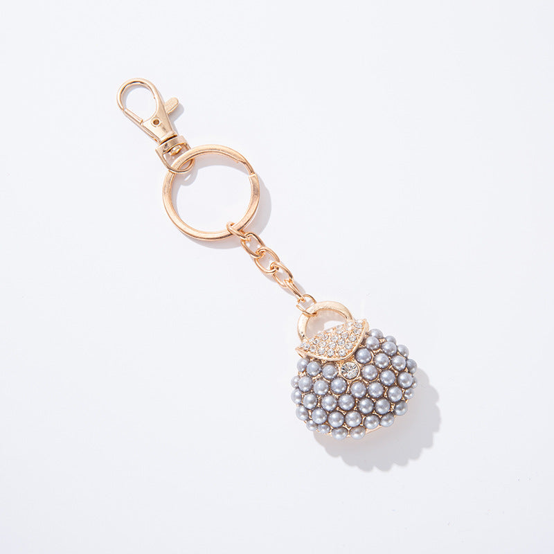Llavero de bolsa de perlas de diamantes de aleación al por mayor