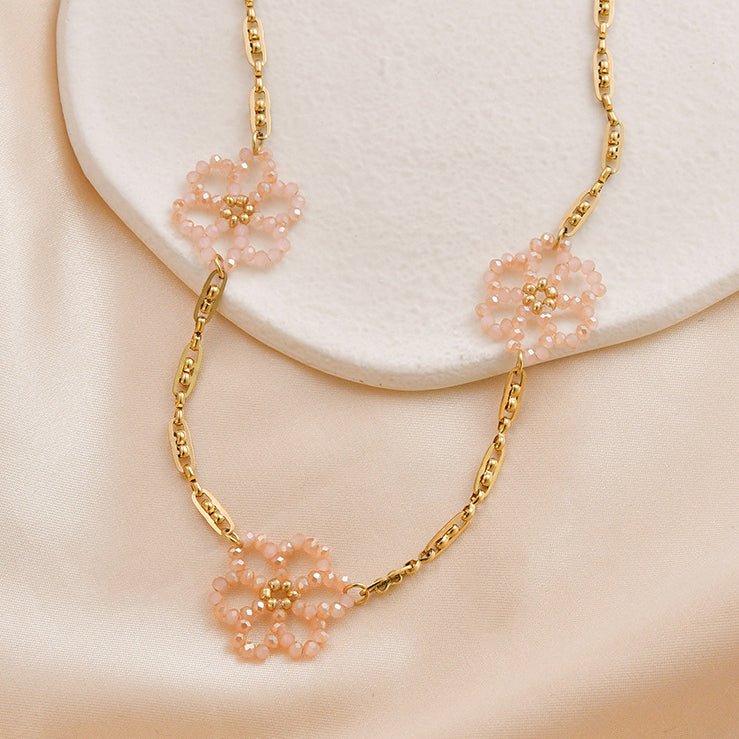 Collar floreciente de la flor de la perla del arroz cristalino rosado al por mayor del acero de titanio