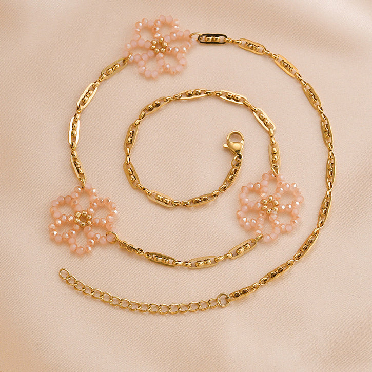 Collar floreciente de la flor de la perla del arroz cristalino rosado al por mayor del acero de titanio