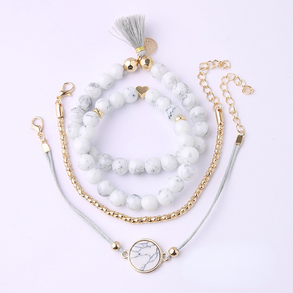 Juego de cuatro pulseras de aleación de disco con borla turquesa al por mayor