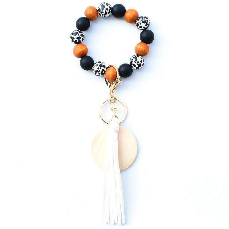 Venta al por mayor PU impreso borla colgante muñeca llavero