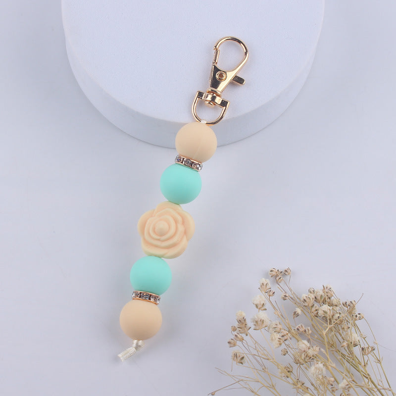 Llavero con cuentas de silicona rosa de doble cara al por mayor