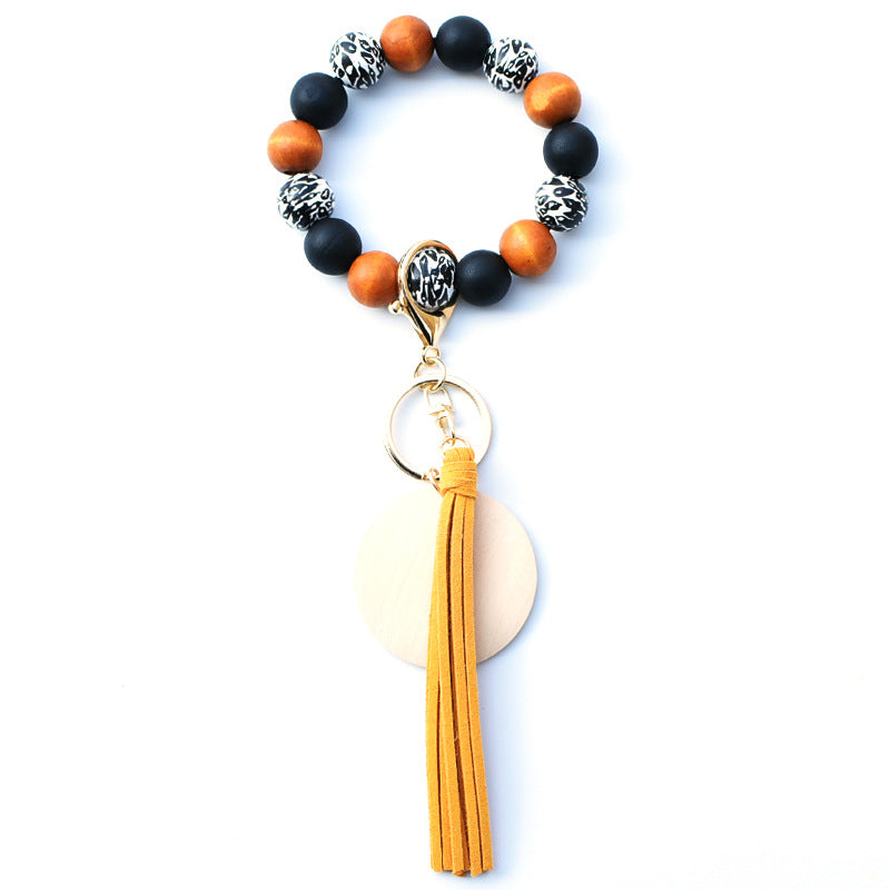 Venta al por mayor PU impreso borla colgante muñeca llavero