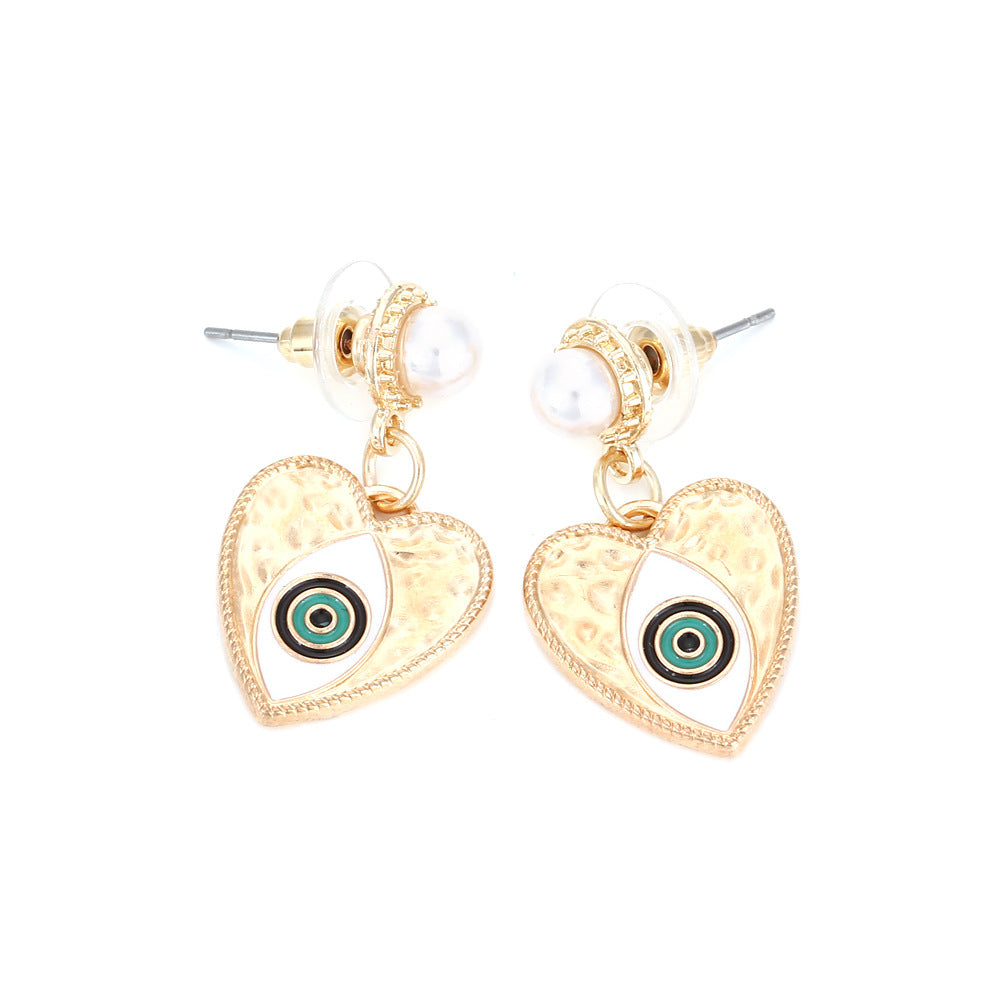 Venta al por mayor Pendientes de aleación vintage con forma de corazón de ojo de diablo