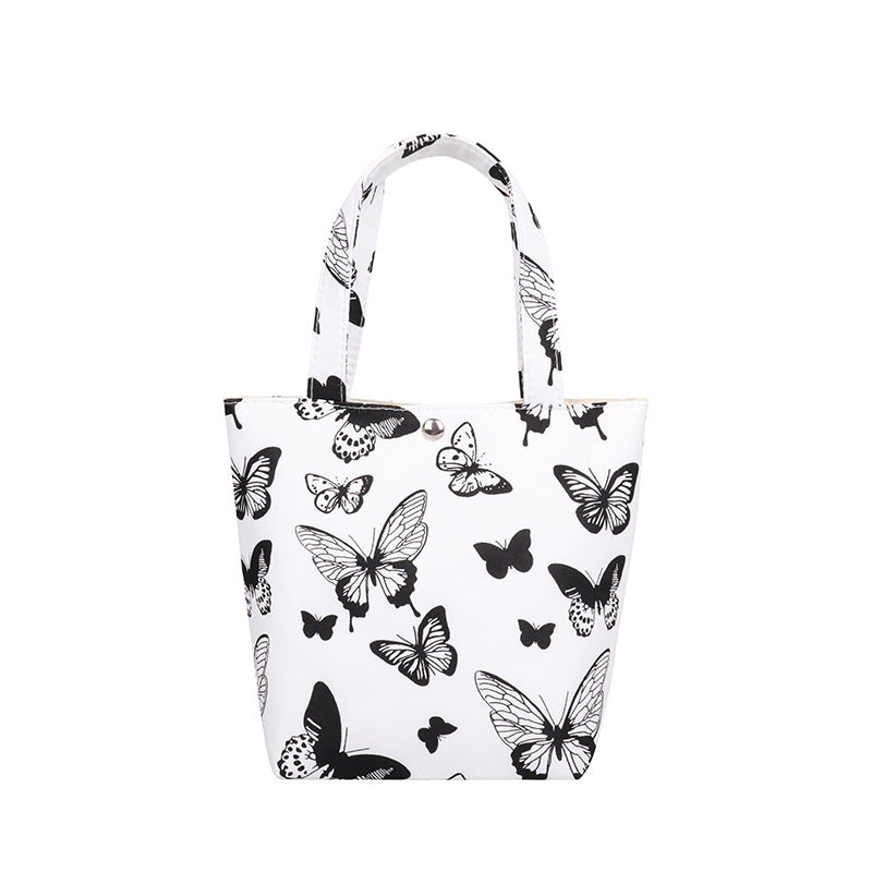 La bolsa de asas de mariposa con estampado de leopardo y estampado de vaca de poliéster al por mayor