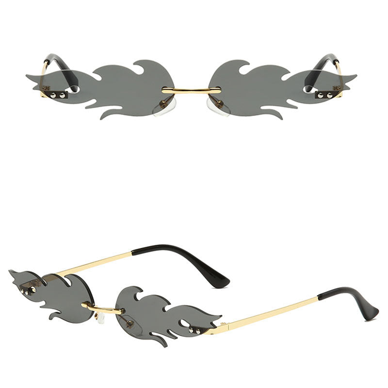 Venta al por mayor de PC llama gafas de sol sin marco en forma de metal para damas