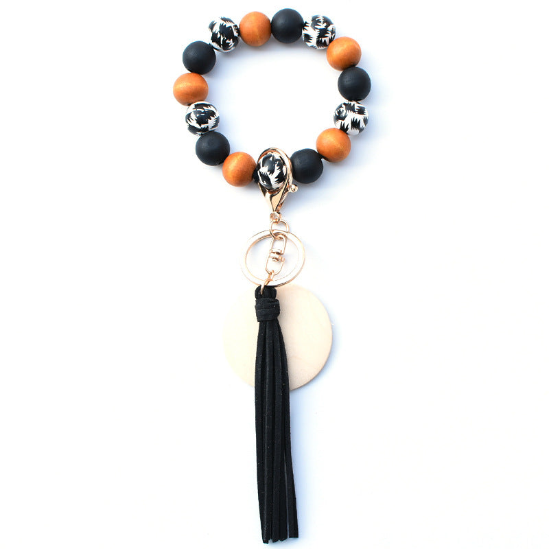 Venta al por mayor PU impreso borla colgante muñeca llavero